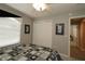 A bedroom with a closet, queen size bed and two pieces of wall art at 1412 Forest Acres Dr, The Villages, FL 32162