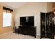 Living room featuring a TV and oriental decorations at 1412 Forest Acres Dr, The Villages, FL 32162