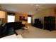 Bright living room with dark colored furniture, fan, and large windows at 1412 Forest Acres Dr, The Villages, FL 32162