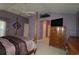 Comfortable main bedroom with vaulted ceiling, wooden dresser, and serene atmosphere at 1412 Forest Acres Dr, The Villages, FL 32162