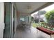 Relaxing screened porch with comfortable seating and views of the backyard at 1412 Forest Acres Dr, The Villages, FL 32162