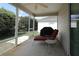 Comfortable outdoor space with a lounge chair and view of the lush backyard at 1412 Forest Acres Dr, The Villages, FL 32162