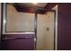 An enclosed tiled shower with a glass sliding door, in a purple walled bathroom at 1412 Forest Acres Dr, The Villages, FL 32162