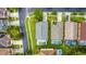 Aerial view of neighborhood homes with screened in pools and green lawns at 167 Castaway Beach Way, Kissimmee, FL 34746