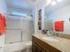 Well-maintained bathroom with granite vanity top, shower-tub combination, and modern fixtures at 167 Castaway Beach Way, Kissimmee, FL 34746