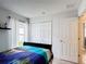 Inviting bedroom with a closet, natural light, and neutral decor scheme at 167 Castaway Beach Way, Kissimmee, FL 34746