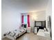 Furnished bedroom with a full-size bed, vanity, and desk, offering a functional living space at 167 Castaway Beach Way, Kissimmee, FL 34746