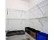 This walk-in closet is equipped with shelves and storage bins at 167 Castaway Beach Way, Kissimmee, FL 34746