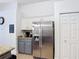 Kitchen area with stainless steel appliances, granite countertops, and modern cabinetry at 167 Castaway Beach Way, Kissimmee, FL 34746