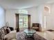 Inviting living room with vaulted ceilings and plenty of natural light at 167 Castaway Beach Way, Kissimmee, FL 34746