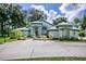 Beautiful single-story home with decorative accents, manicured landscaping, and a paved driveway at 168 Pond Rd, Mount Dora, FL 32757