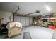 Spacious two-car garage with ample storage space, workspace, and shelving at 168 Pond Rd, Mount Dora, FL 32757
