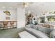 Open living room with fireplace, bar seating, and comfortable furniture at 168 Pond Rd, Mount Dora, FL 32757
