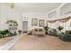 Bright and airy living room featuring carpet, high ceilings, and large windows at 168 Pond Rd, Mount Dora, FL 32757