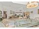 Open-concept living and dining area with elegant furnishings and plenty of natural light at 168 Pond Rd, Mount Dora, FL 32757