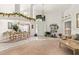 Spacious living and dining area with high ceilings, large windows, and elegant decor at 168 Pond Rd, Mount Dora, FL 32757