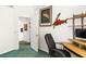Office room with mounted fish decorations, desk, and open doorway at 168 Pond Rd, Mount Dora, FL 32757