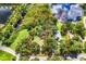 Aerial view of wooded home lot with stunning pond views and defined property lines at 168 Pond Rd, Mount Dora, FL 32757