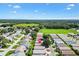 Aerial view showcases a well-planned community surrounded by green spaces and nearby amenities at 16938 Se 94Th Sunnybrook Cir, The Villages, FL 32162