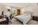 Comfortable carpeted bedroom with home office area and natural light at 16938 Se 94Th Sunnybrook Cir, The Villages, FL 32162
