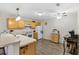Eat-in kitchen with white appliances and wood cabinets at 16938 Se 94Th Sunnybrook Cir, The Villages, FL 32162