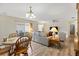 Open-concept living and dining area with plenty of space to entertain guests at 16938 Se 94Th Sunnybrook Cir, The Villages, FL 32162