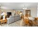 Open-concept living and dining area features new floors and lots of natural light at 16938 Se 94Th Sunnybrook Cir, The Villages, FL 32162