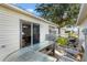 Inviting patio with outdoor seating and a grill, perfect for enjoying meals and relaxing in the fresh air at 16938 Se 94Th Sunnybrook Cir, The Villages, FL 32162