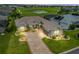 Beautiful home with lush landscaping and a golf course view at 17599 Se 121St Cir, Summerfield, FL 34491