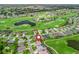 Aerial view of the property in a community, showcasing its location near a golf course at 17599 Se 121St Cir, Summerfield, FL 34491