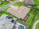 An aerial view highlights the home, its landscaped grounds, and a screened patio for outdoor living at 17599 Se 121St Cir, Summerfield, FL 34491