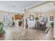Open dining room area near the kitchen is bright with natural light, neutral walls and tiled flooring at 17599 Se 121St Cir, Summerfield, FL 34491