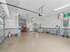 Spacious garage with workbench, shelving and overhead storage at 17599 Se 121St Cir, Summerfield, FL 34491