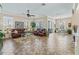 Open-concept living room and dining area featuring tile flooring and large windows at 17599 Se 121St Cir, Summerfield, FL 34491