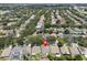 An aerial view displaying the property amid lush trees and surrounding homes in a well-established neighborhood at 1808 Westpointe Cir, Orlando, FL 32835