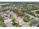 This aerial view highlights a house surrounded by lush trees and greenery in a residential neighborhood at 1808 Westpointe Cir, Orlando, FL 32835