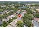 An aerial view of a residential area showcasing the house among tree-lined streets and nearby lakes at 1808 Westpointe Cir, Orlando, FL 32835