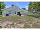 A backyard features a grassy area and outdoor patio space, with an exterior view of the residence at 1808 Westpointe Cir, Orlando, FL 32835