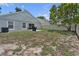 The backyard features a grassy area and patio space, with an exterior view of the residence at 1808 Westpointe Cir, Orlando, FL 32835