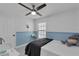 Cozy bedroom with a blue and white color scheme, featuring a comfortable bed and a plush toy at 1808 Westpointe Cir, Orlando, FL 32835