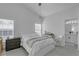 Bright bedroom with a comfortable bed, work desk, and easy access to the bathroom at 1808 Westpointe Cir, Orlando, FL 32835
