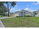 A cozy single-story home with an attached two-car garage and well-kept lawn and garden at 1808 Westpointe Cir, Orlando, FL 32835