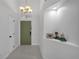 A foyer featuring a green door, white walls, and tiled flooring at 1808 Westpointe Cir, Orlando, FL 32835
