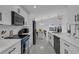 Modern kitchen with stainless steel appliances and an open floor plan at 1808 Westpointe Cir, Orlando, FL 32835