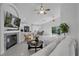 Bright living room featuring a fireplace, tile flooring, and modern furnishings at 1808 Westpointe Cir, Orlando, FL 32835