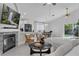 Bright living room featuring a fireplace, tile flooring, and modern furnishings at 1808 Westpointe Cir, Orlando, FL 32835