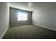 Neutral bedroom with carpet and a window, providing a clean and comfortable space at 2064 Asher Ave, Minneola, FL 34715