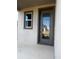 Charming front door with decorative glass and sidelight window at 2064 Asher Ave, Minneola, FL 34715