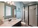 Contemporary bathroom featuring a walk-in shower, neutral countertop and modern fixtures at 2136 Lula Rd, Minneola, FL 34715