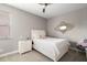 Neutral bedroom offers lots of natural light and features a ceiling fan and white bedroom set at 2136 Lula Rd, Minneola, FL 34715
